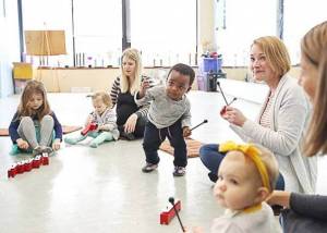 happy children and mothers at a toddler music class in Tampa