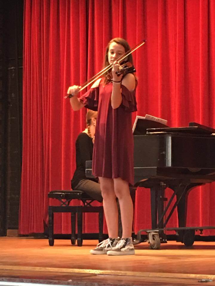 teenage girl taking violin lessons in New York