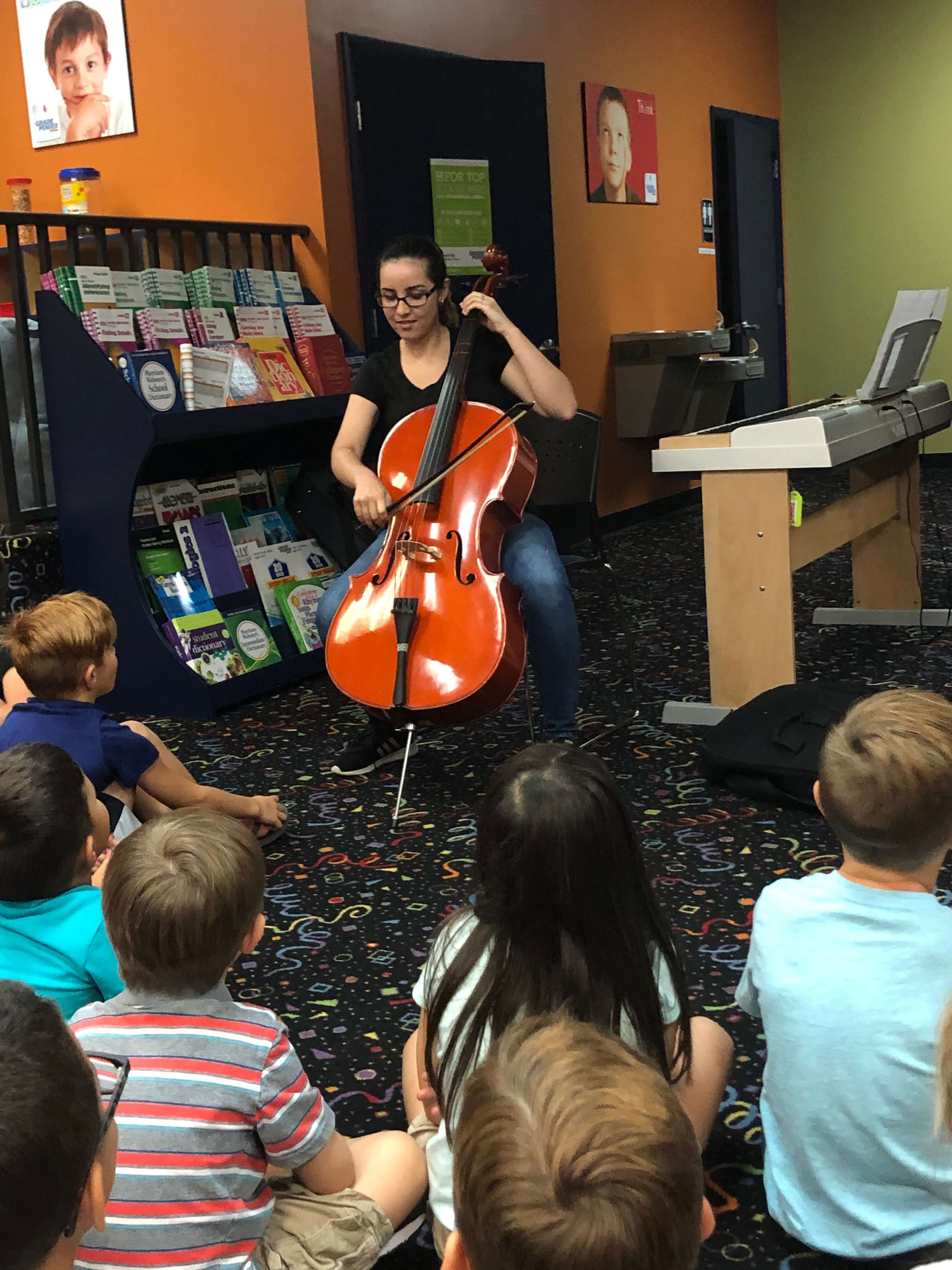 a teacher demonstration during cello lessons in New York