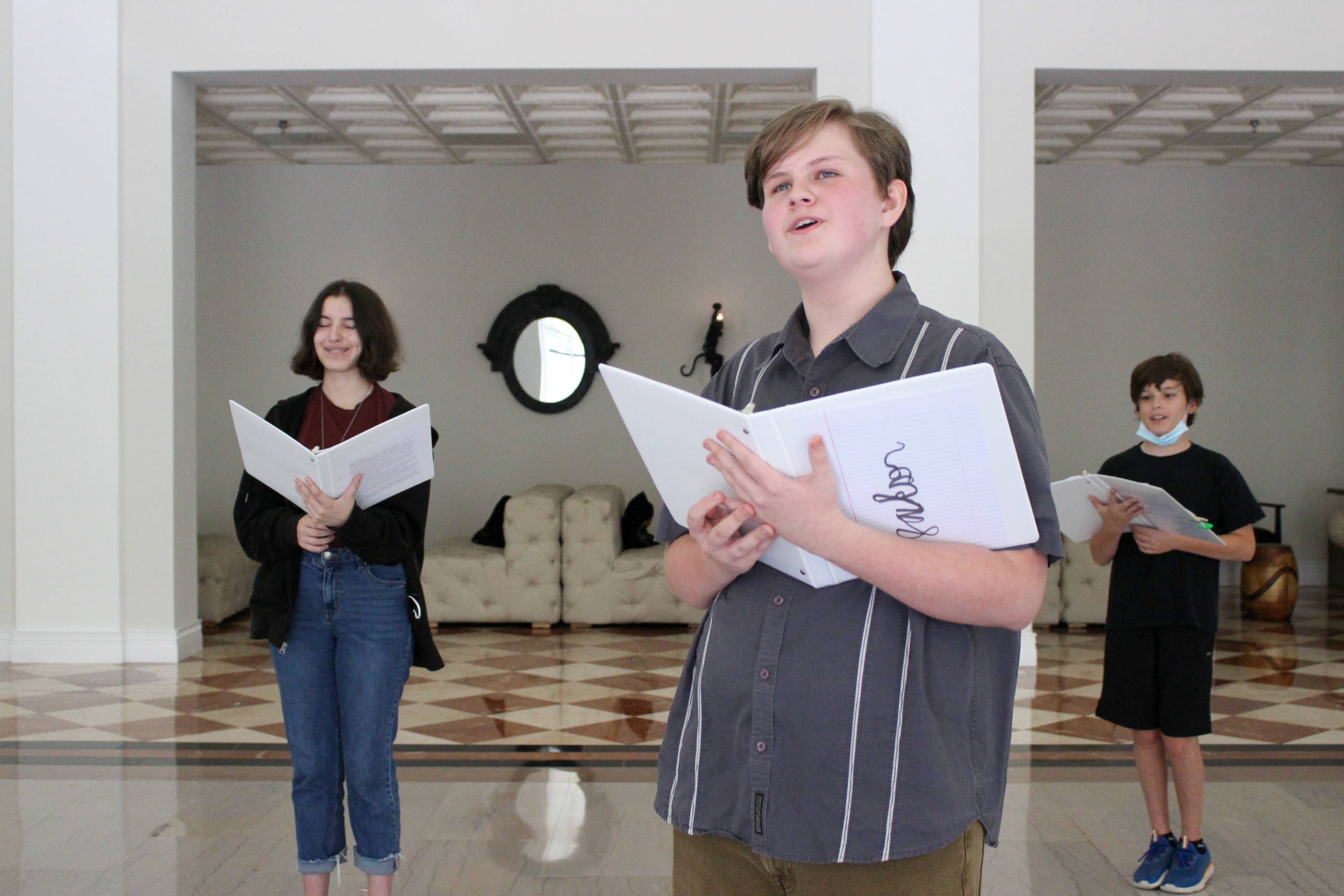 Three kids singing in their music lessons in New York